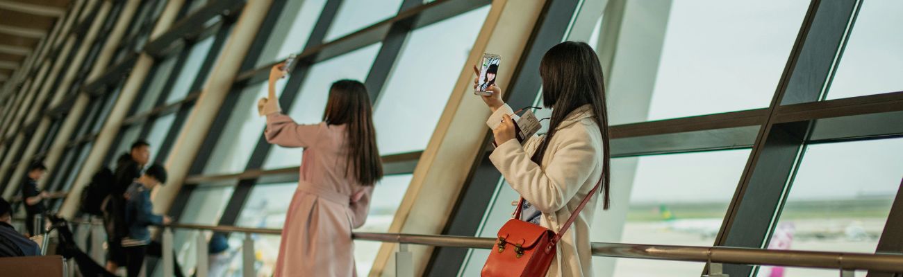ladies taking selfies at Shanghai Pudong International Airport