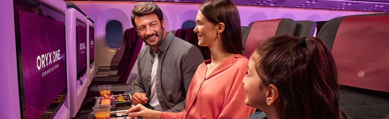 qatar-airways-family-on-plane