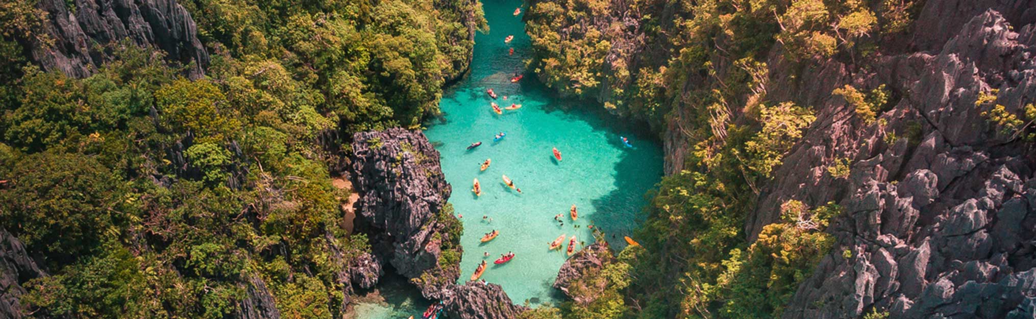 Aerial view of tourists entering the Small Lagoon in Maniloc Island, El Nido, Palawan, Philippines