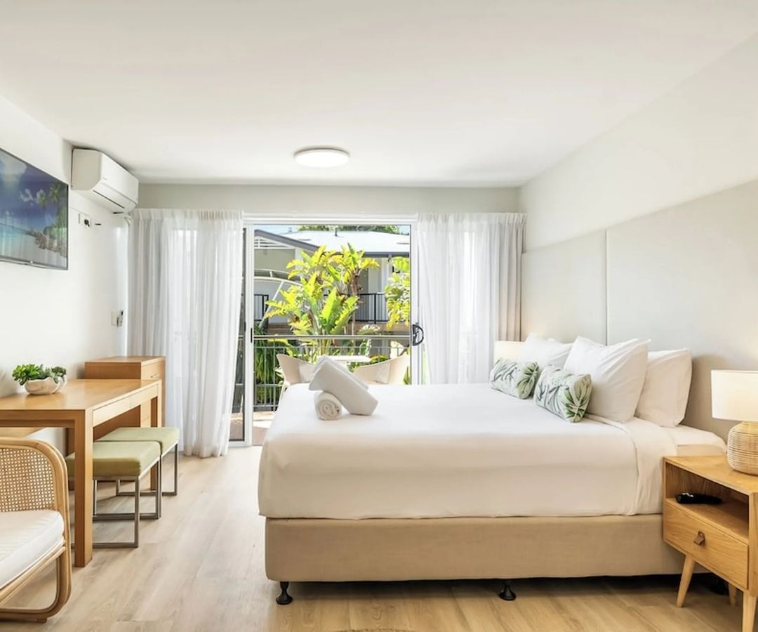 Bright modern hotel room with balcony