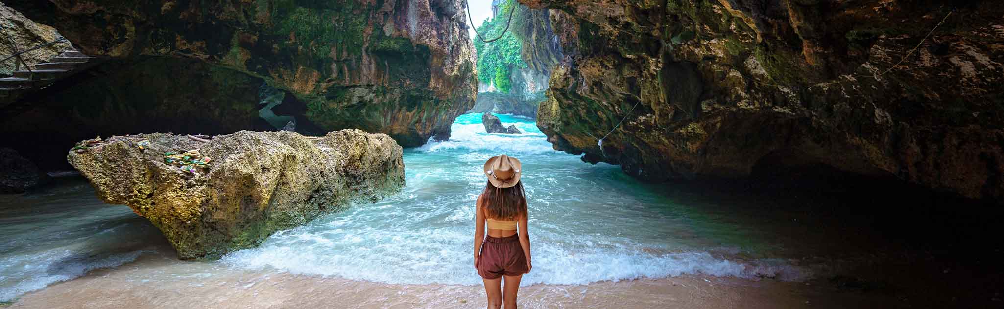 Uluwatu Bali girl looking out to surf entrance