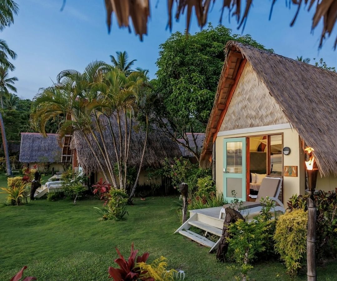 Small hut with palm tree