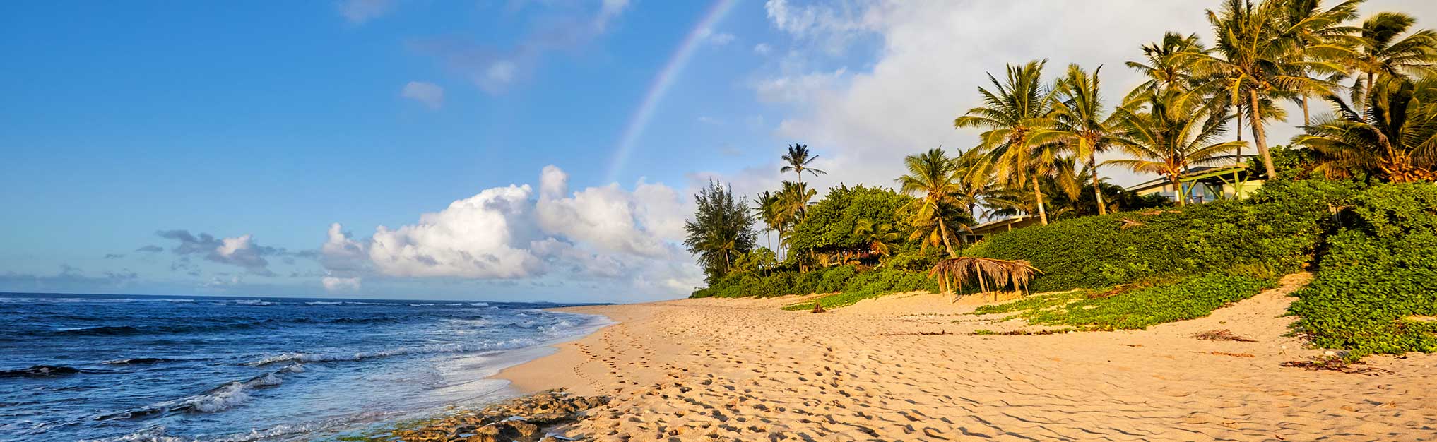 rainbow scenic view over the popular surfing place Sunset Beach, North Shore, Oahu, Hawaii, USA
