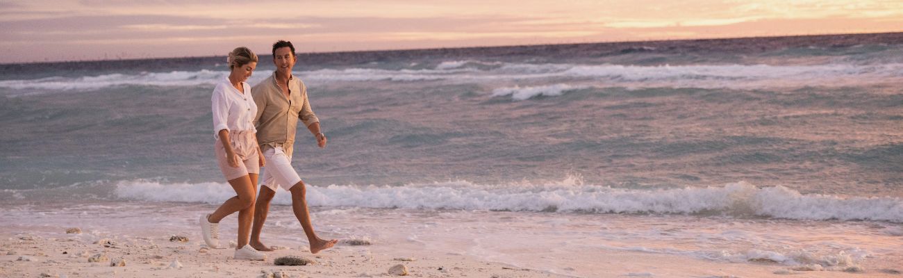 Couple walking at beach in Bundaberg