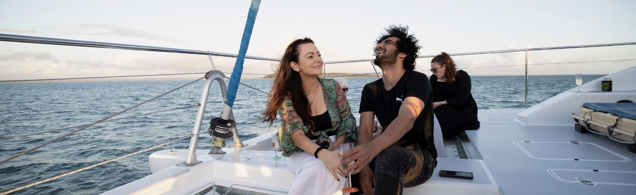 Happy couple on boat at Hervey Bay