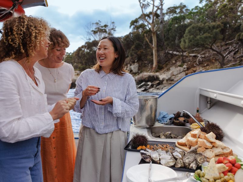 friends eating seafood hobart