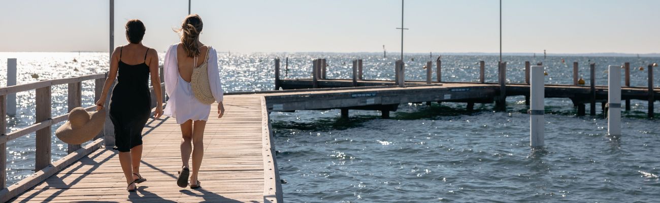 women-walking-on-pier-perth