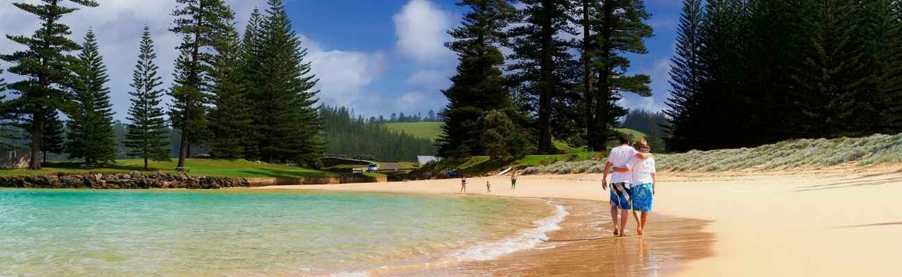 couple walking on beach norfolk island
