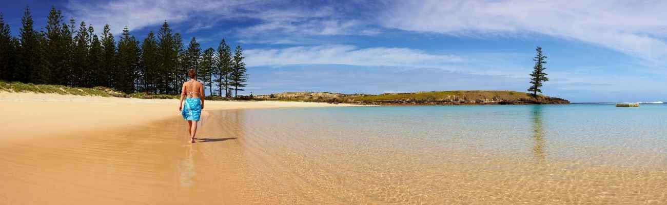 lady walking on beach norfolk island