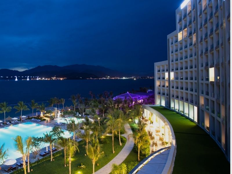 nighttime view of hotel pool