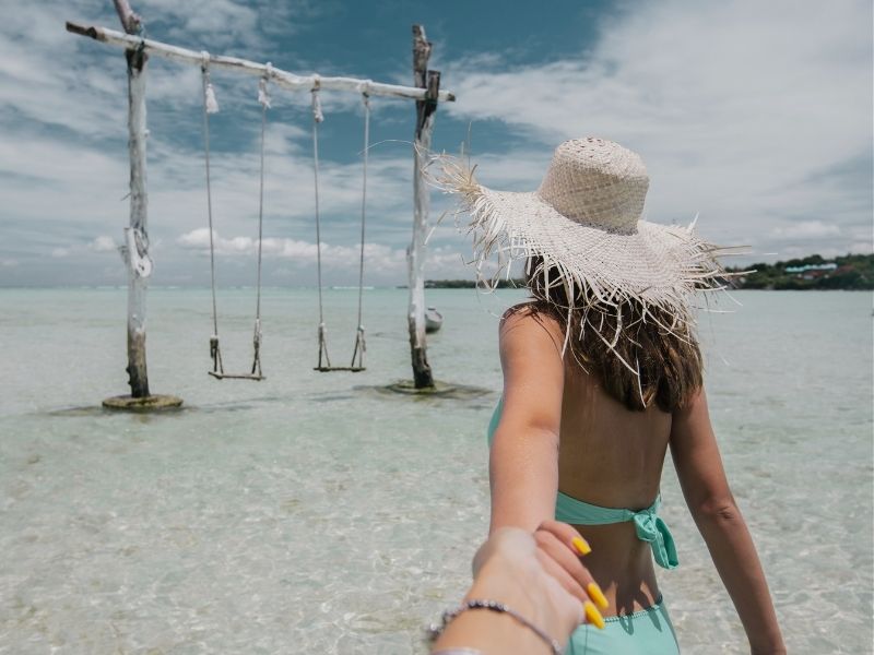lady at bali beach swings