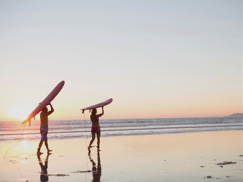 surfers on beach