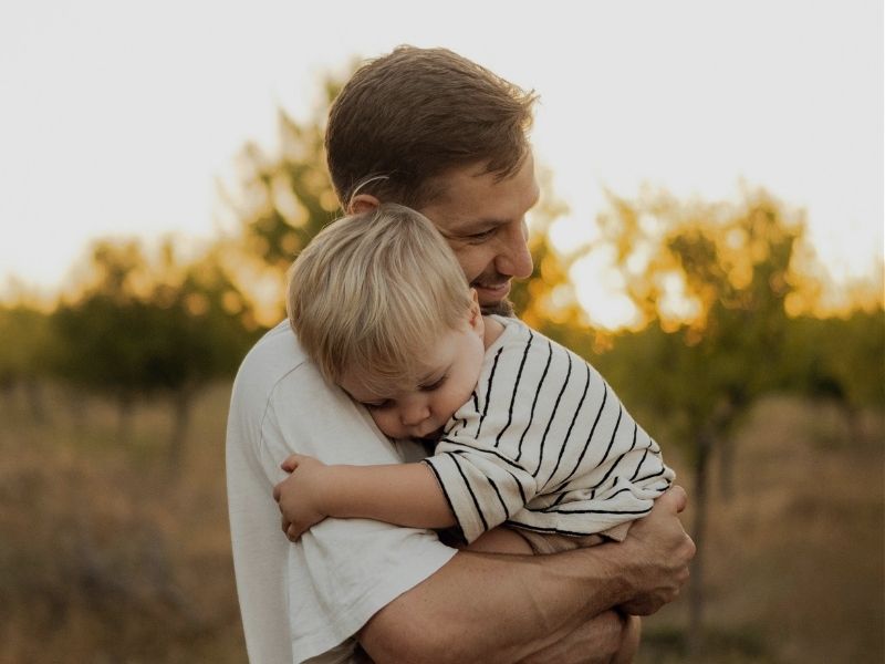 father and son hugging