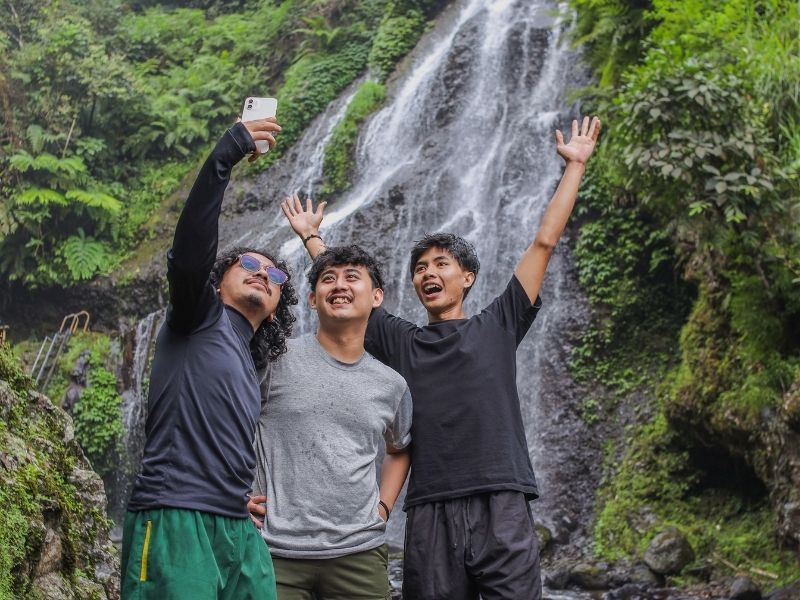 friends at a waterfall