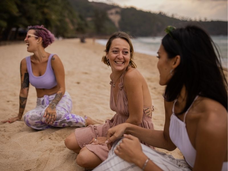 friends relaxing on beach