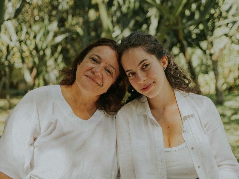 mother and daughter smiling