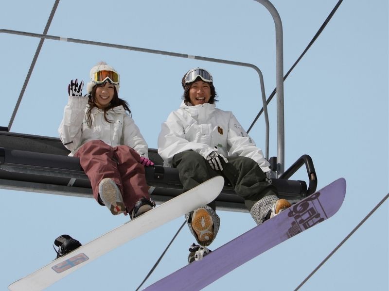 skiers on lift