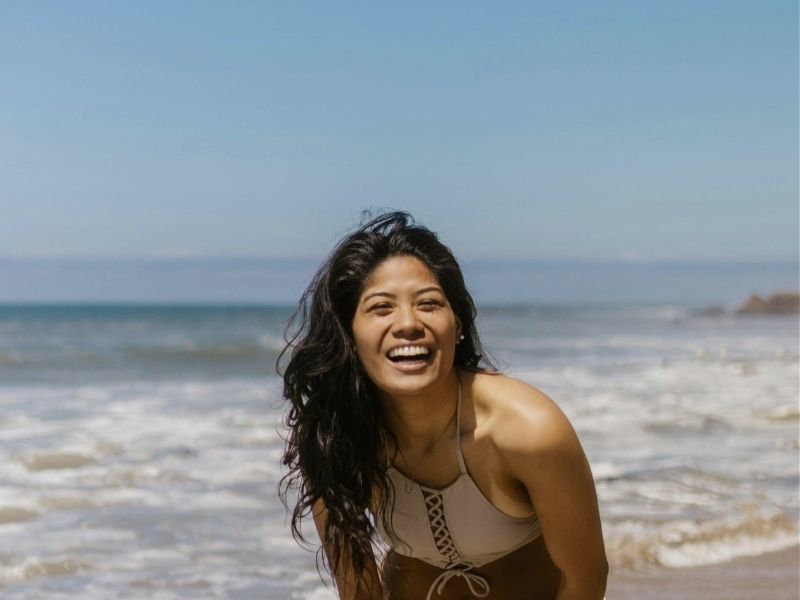 girl smining on beach