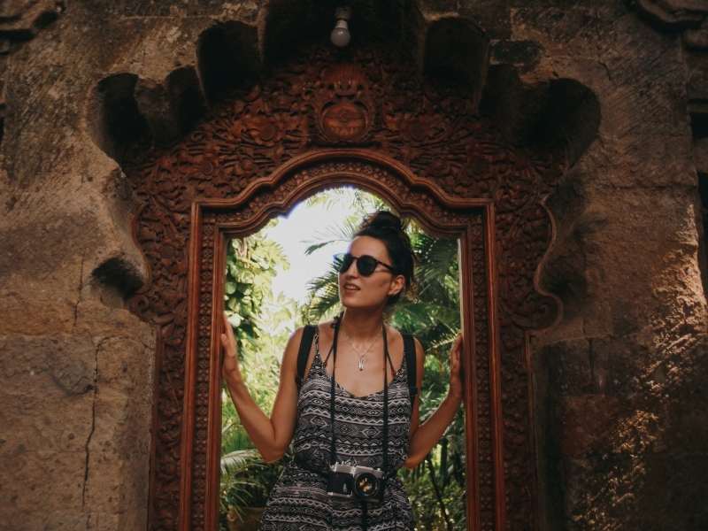 women exploring ruins