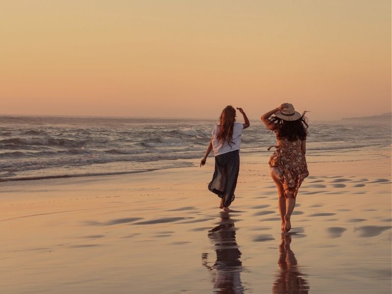friends walking on beach
