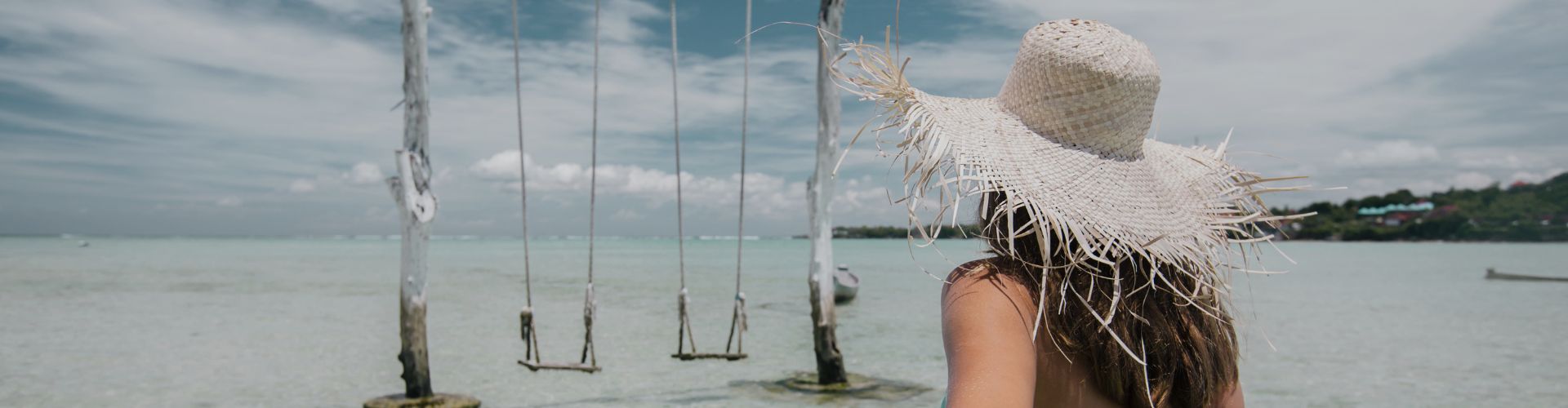 lady walking by beach swings in bali