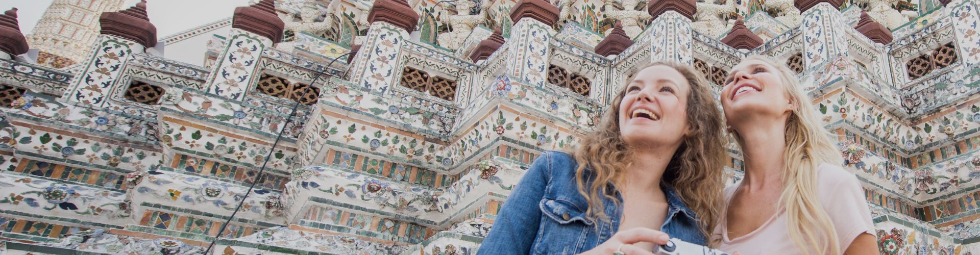 happy friends at temple in bangkok